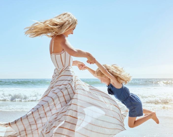 woman swinging her kid