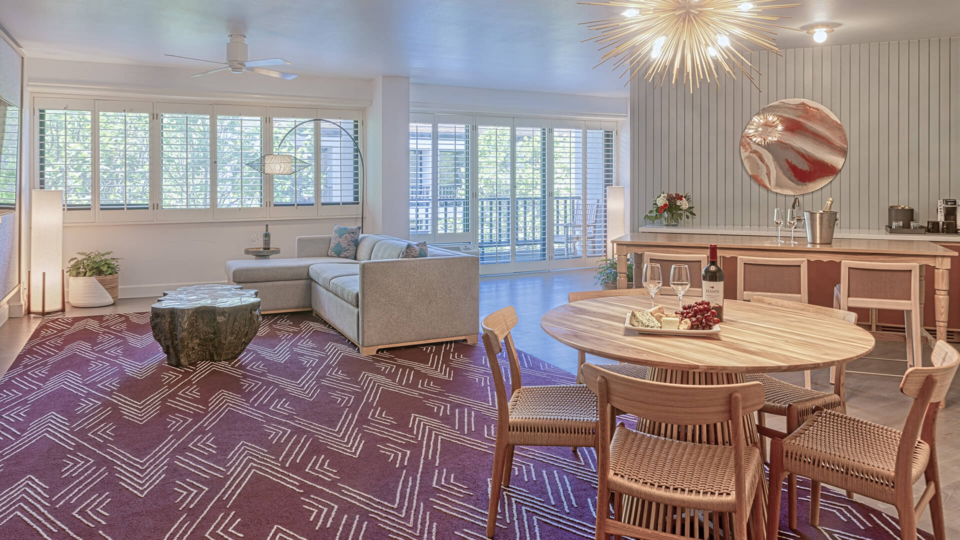 Hospitality suite living room and dining space. 