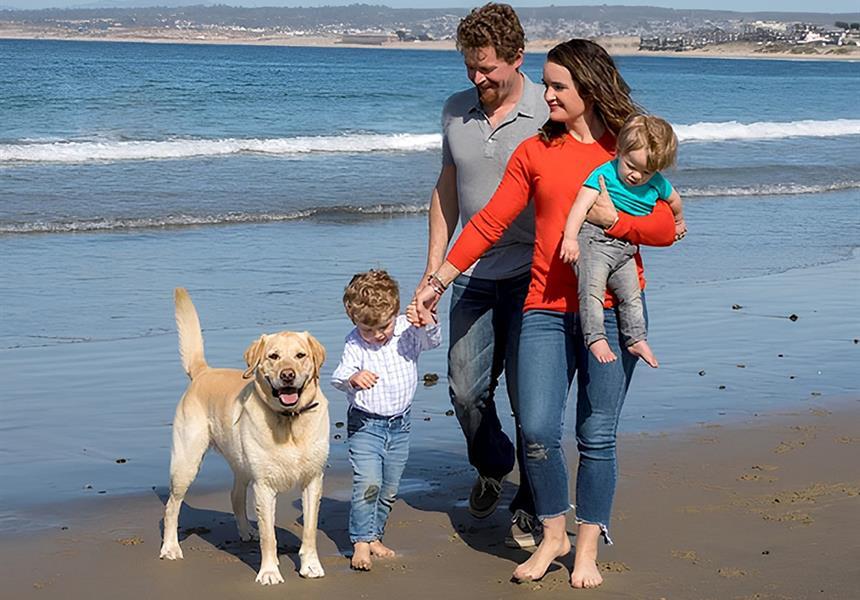 Family walking on the beach.