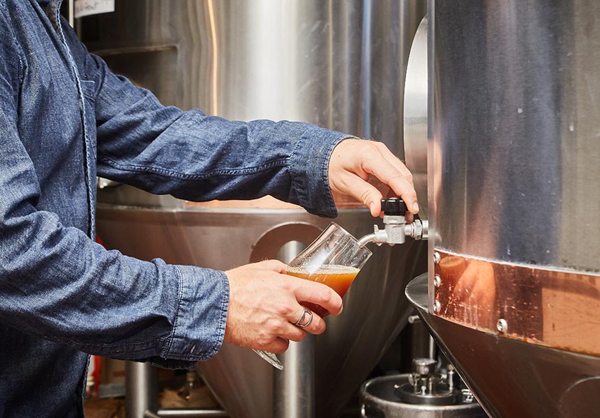 Brewer pouring a pint.