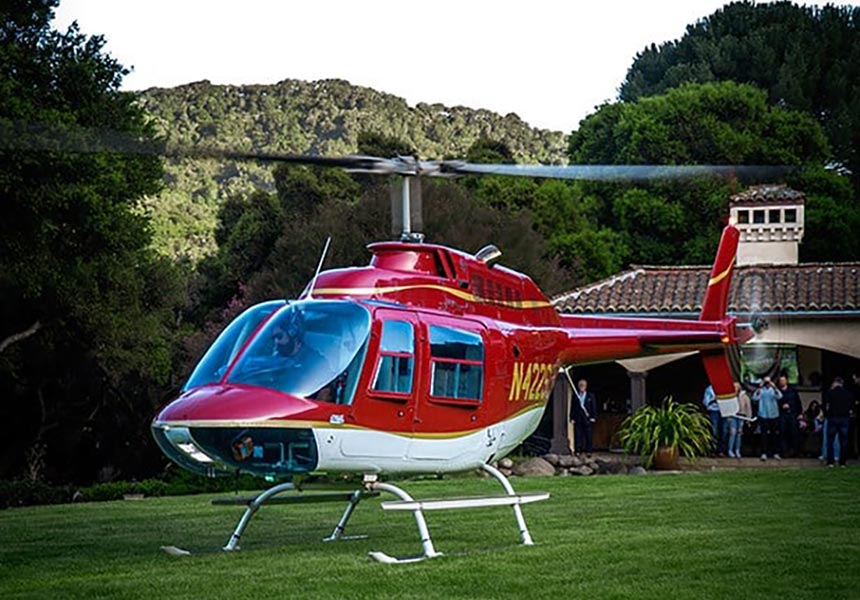 A helicopter at a vineyard.