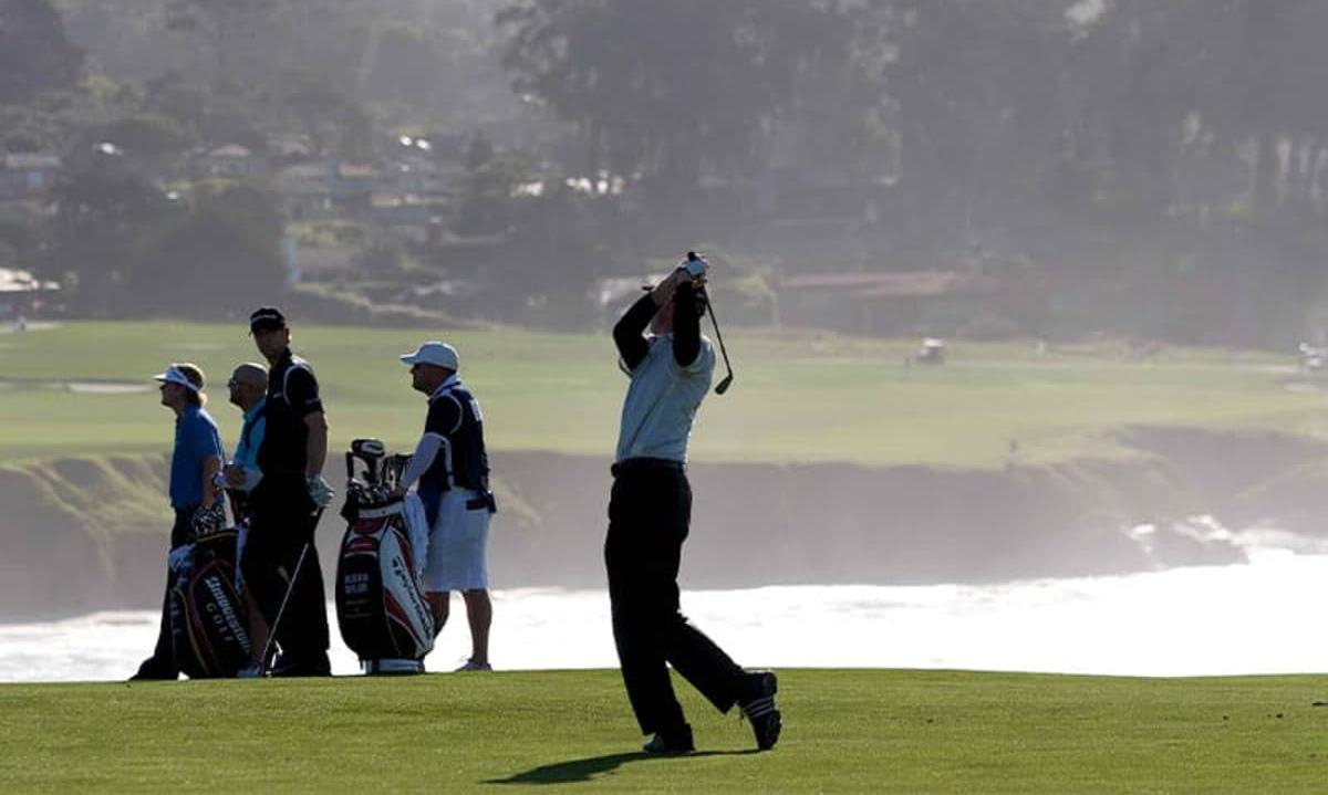 People golfing on golf course