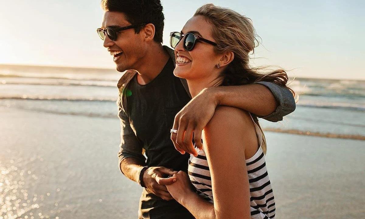 Couple holding each other on the beach