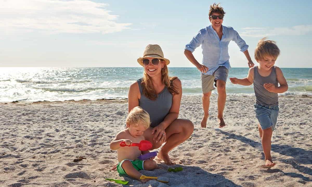 Family playing on the beach