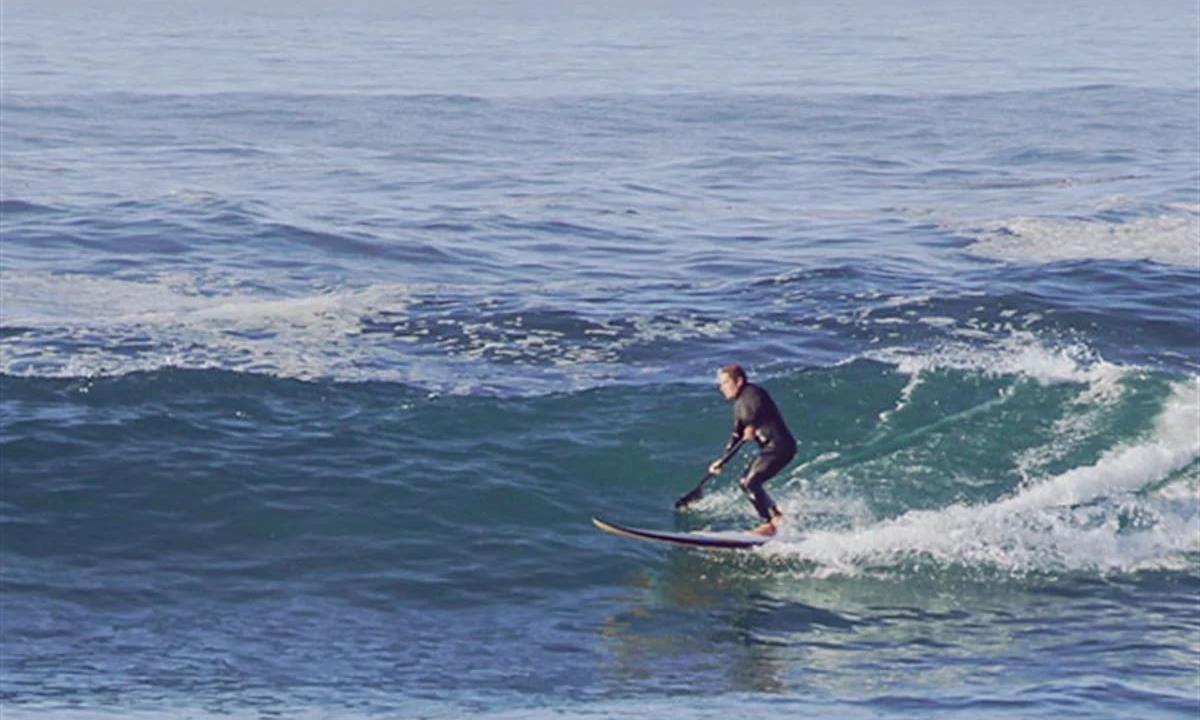 man surfing wave