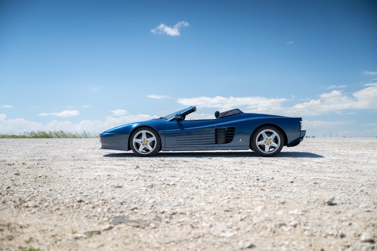 Blue classic car on the road