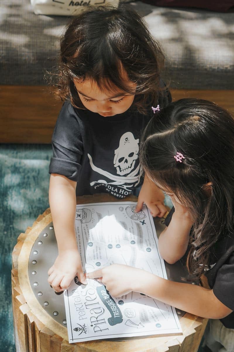 kids coloring a pirate map