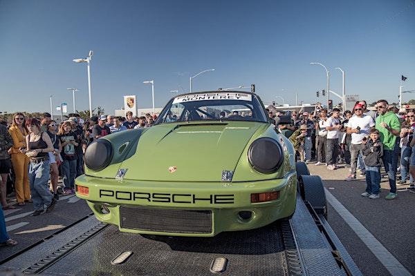 green porsche displayed at car show
