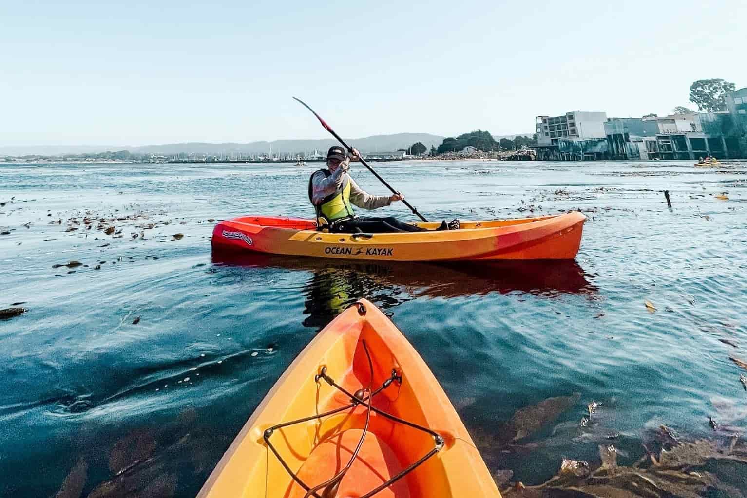 two people kayaking in the harbor