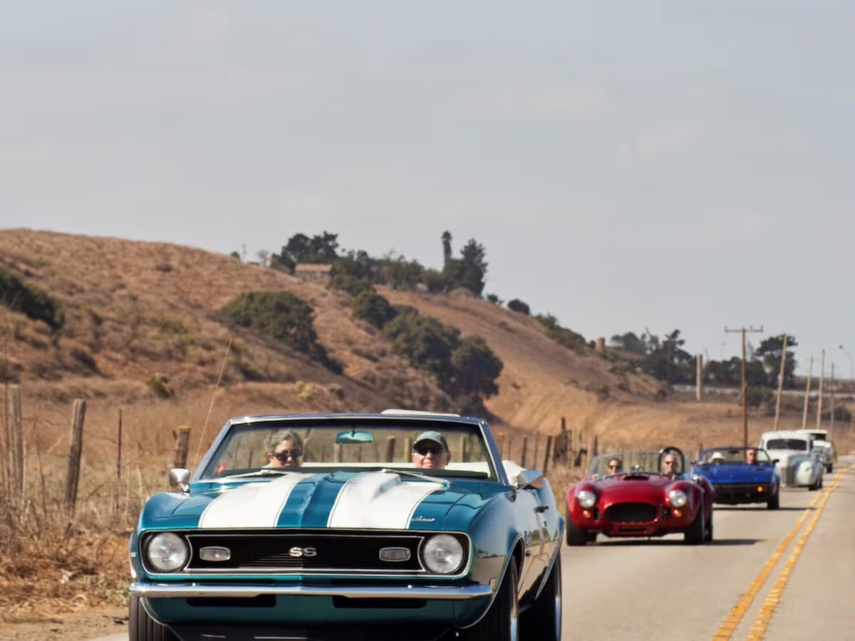 classic cars riding down the highway