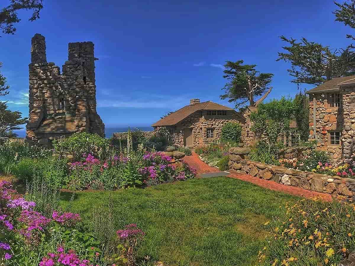 a small cottage surrounded by a garden