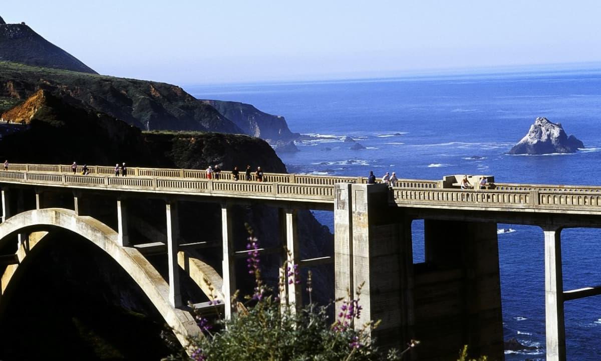 people running marathon on bridge 