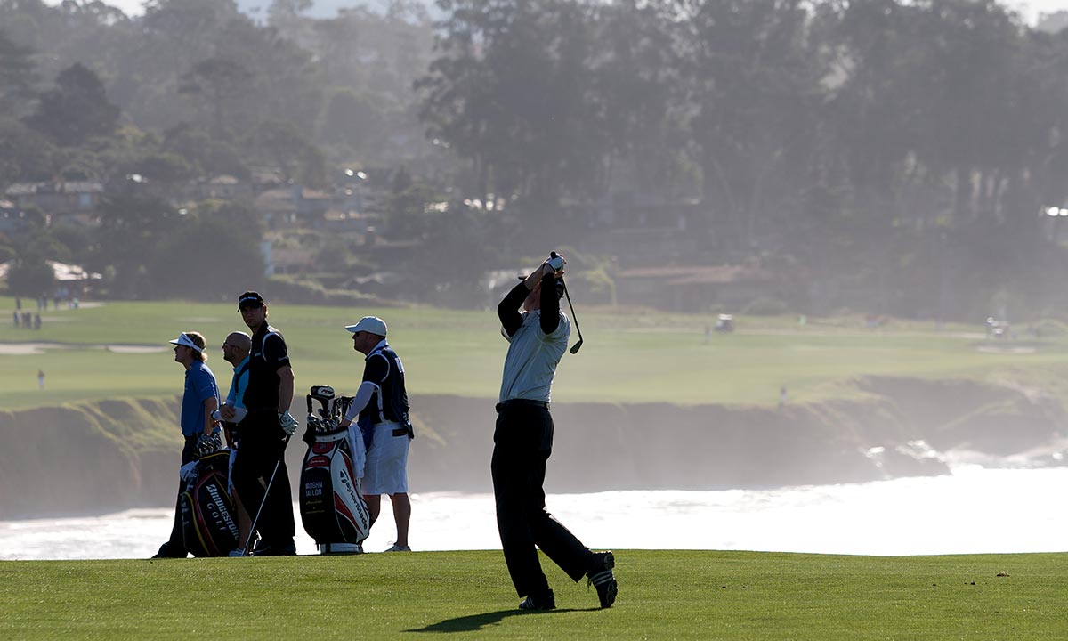 man playing golf on golf course