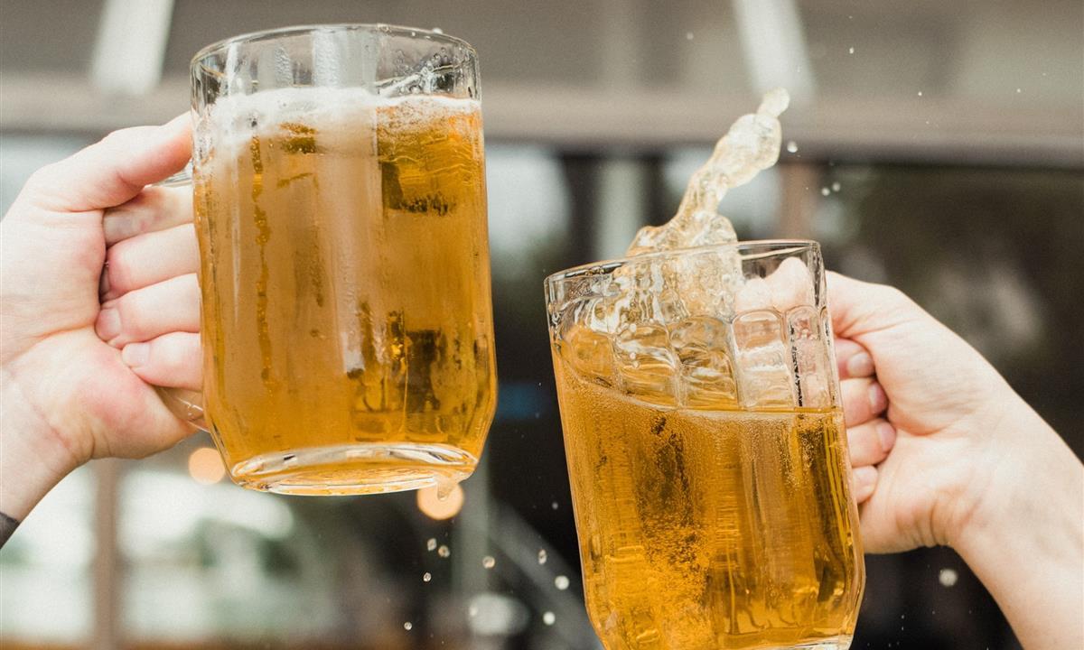 Beer pints sloshing and clinking