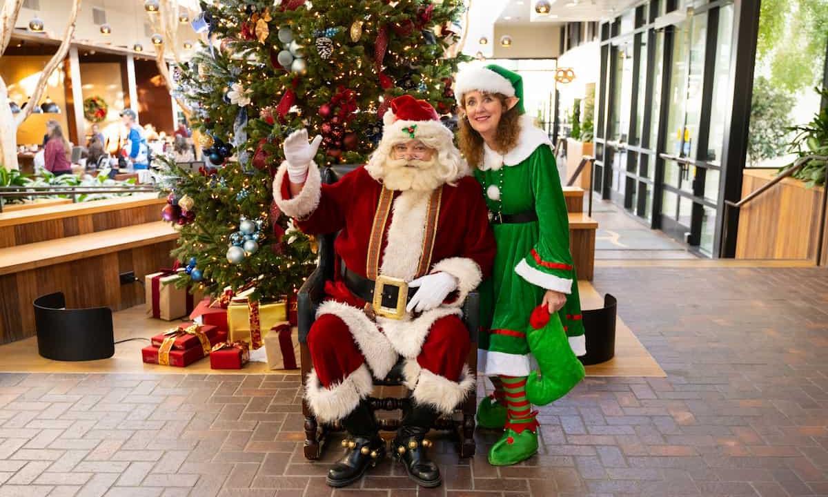 santa and elf waving