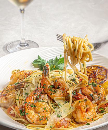 Shrimp scampi with roasted lemon, fresh parsley, and fresh chives
