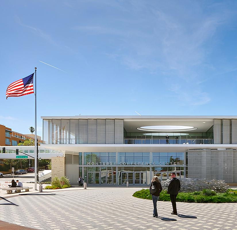 People walking up to a modern building