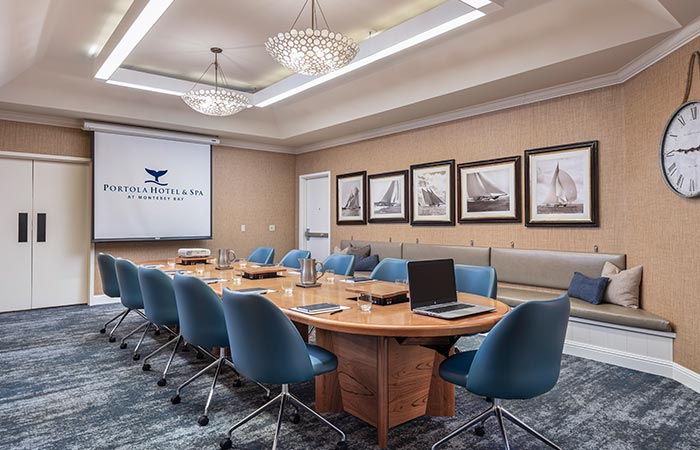 Executive Boardroom with projector screen down.