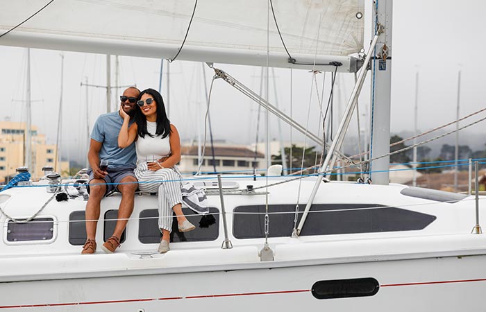 Couple on sailboat.