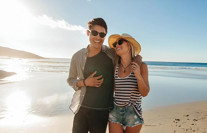 Couple walking on the beach.