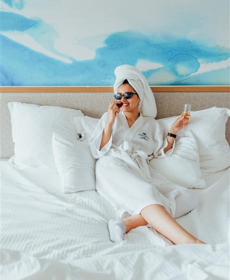 Woman relaxing in the pool on a sunny day. 