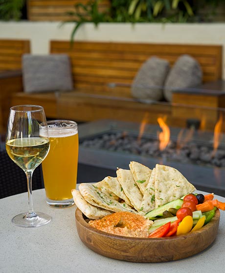 Pita and hummus plate with wine.